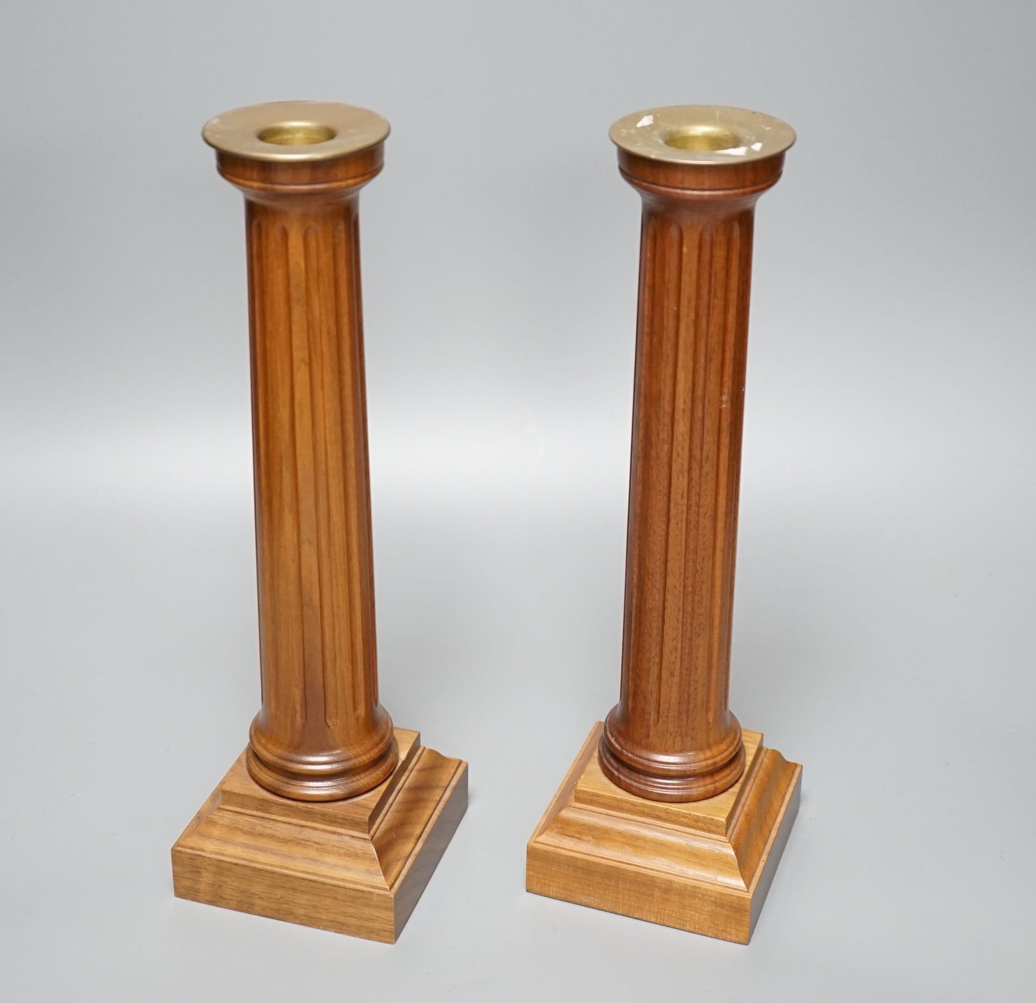 A boxed pair of Linley plinth candlesticks - 30cm high